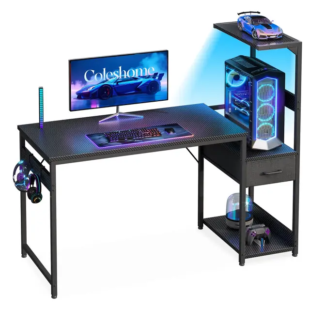 Coleshome Escritorio Gaming con Iluminación LED, 120×48cm Mesa Gaming con Cajones y Estanteria, Mesa Gamer Reversible con Gancho para Cascos, Negro Fibra de Carbono